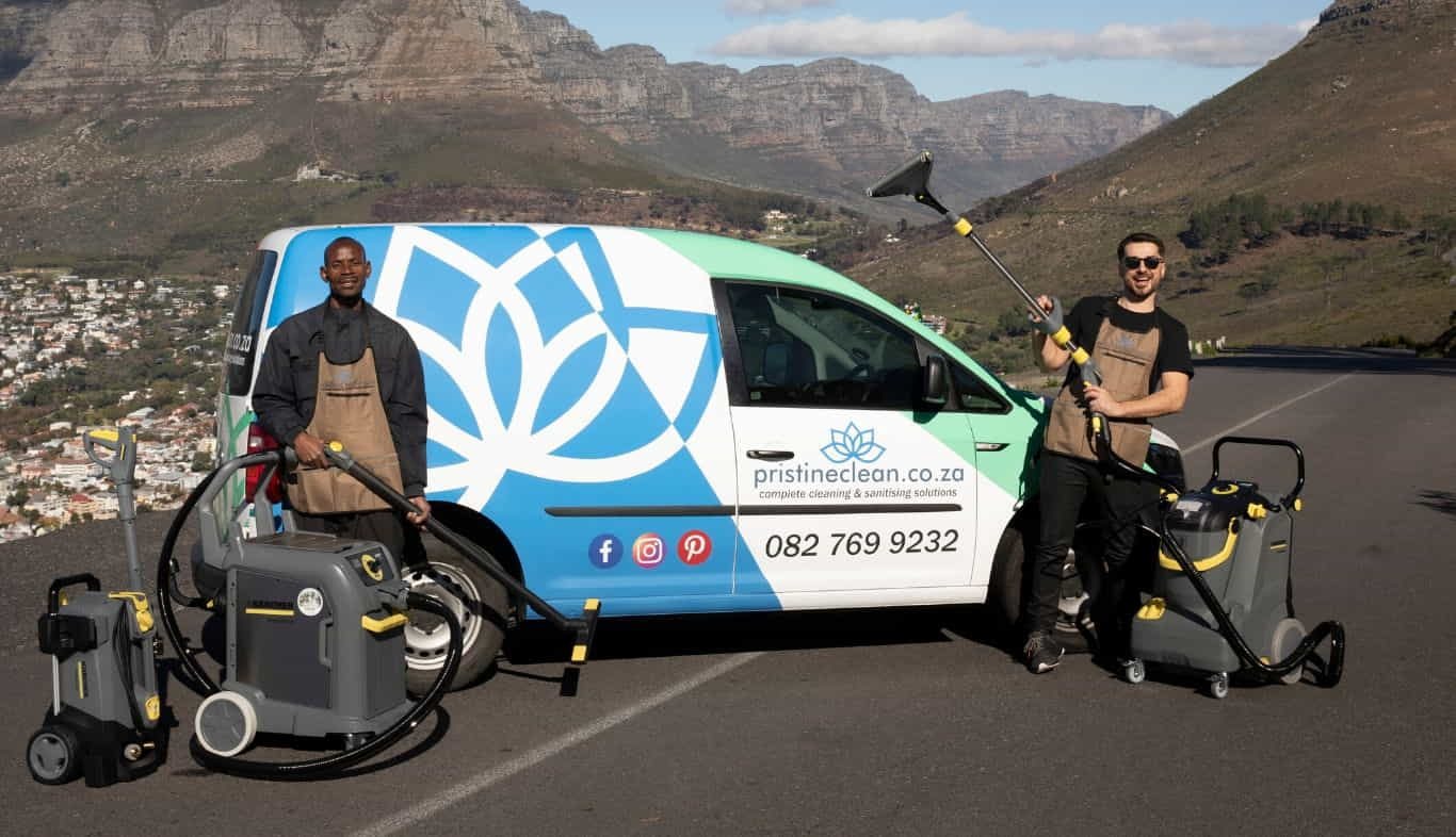 The Pristine Clean crew of 2 with the lotus van and the Kärcher machines on a mountain road above Cape Town
